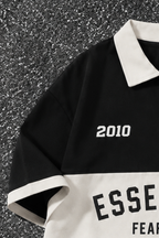 LEGACY VARSITY POLO TEE - BLACK - UNISEX